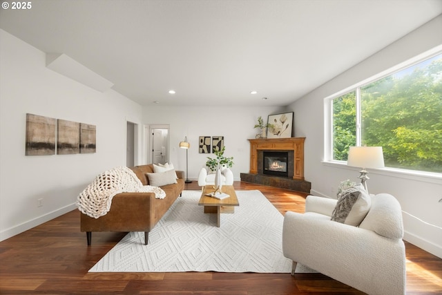 12988 NW Tigon Ln, Portland, OR 97229 - living room featuring recessed lighting, a glass covered fireplace, and wood finished floors