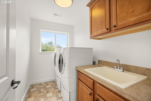 12988 NW Tigon Ln, Portland, OR 97229 - laundry room featuring washer and clothes dryer and cabinet space