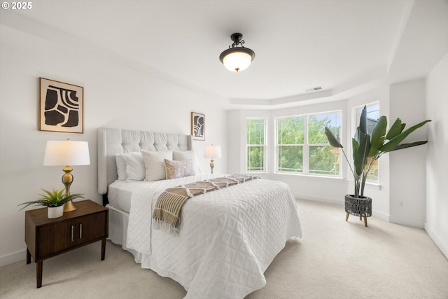 12988 NW Tigon Ln, Portland, OR 97229 - bedroom with carpet floors, multiple windows, and a raised ceiling
