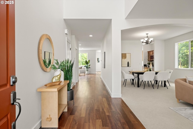 12988 NW Tigon Ln, Portland, OR 97229 - foyer featuring a chandelier, dark wood finished floors, plenty of natural light, and recessed lighting
