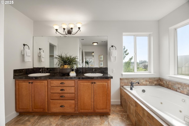 12988 NW Tigon Ln, Portland, OR 97229 - full bathroom with a chandelier, plenty of natural light, double vanity, and a whirlpool tub