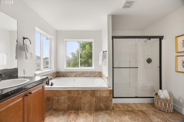 12988 NW Tigon Ln, Portland, OR 97229 - bathroom featuring vanity, a whirlpool tub, and a stall shower