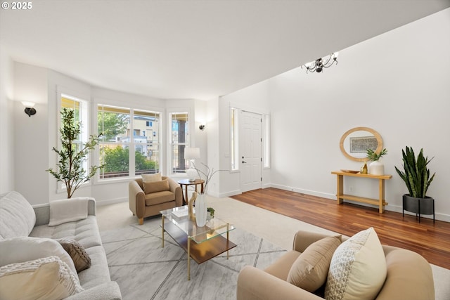 12988 NW Tigon Ln, Portland, OR 97229 - living area featuring wood finished floors and a chandelier