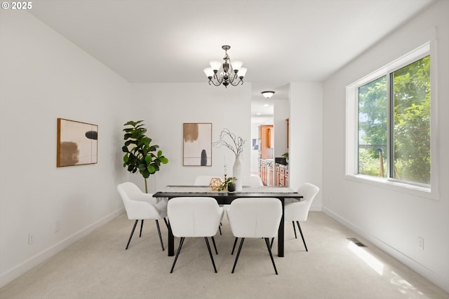 12988 NW Tigon Ln, Portland, OR 97229 - dining area featuring a chandelier and light carpet