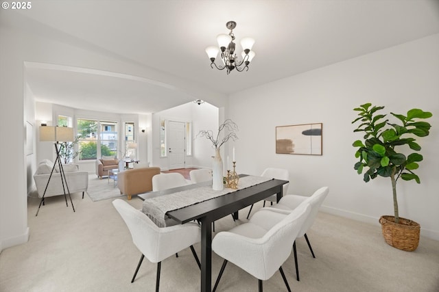 12988 NW Tigon Ln, Portland, OR 97229 - dining room featuring light carpet and a chandelier