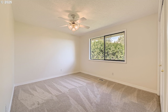 15911 NE 29th Ave, Ridgefield, WA 98642 - empty room with light carpet, a ceiling fan, and a textured ceiling