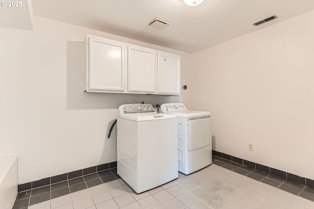 15911 NE 29th Ave, Ridgefield, WA 98642 - washroom with cabinet space, washing machine and dryer, and light tile patterned floors
