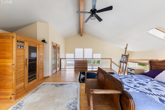 34700 Hill St, Pacific City, OR 97135 - bedroom with beam ceiling, wood finished floors, multiple windows, a skylight, and high vaulted ceiling