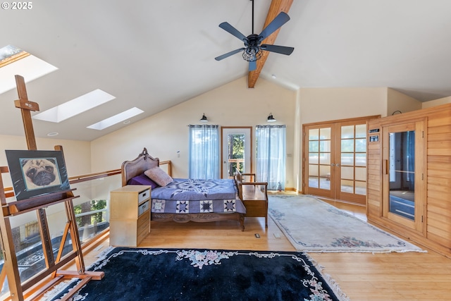 34700 Hill St, Pacific City, OR 97135 - bedroom with french doors, wood finished floors, a skylight, and a ceiling fan