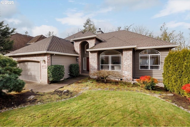 ranch-style house featuring a garage and a front lawn