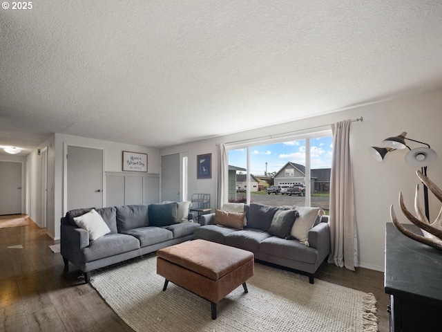 1408 25th St, La Grande, OR 97850 - living room with wood finished floors, a textured ceiling, and baseboards