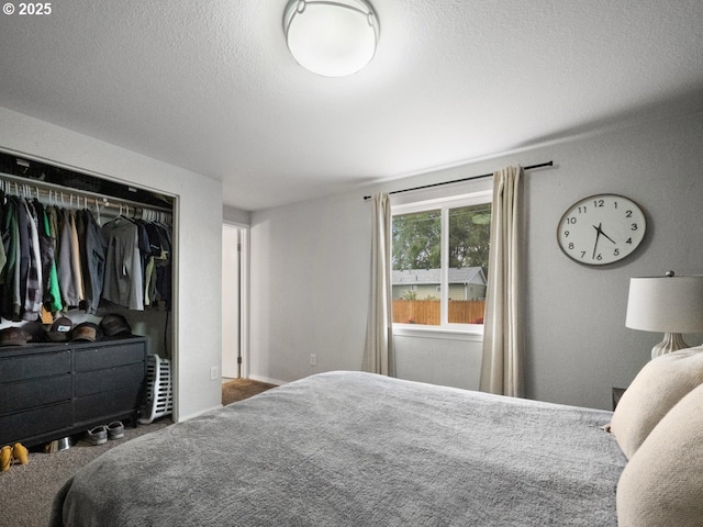 1408 25th St, La Grande, OR 97850 - bedroom with a closet, a textured ceiling, and carpet
