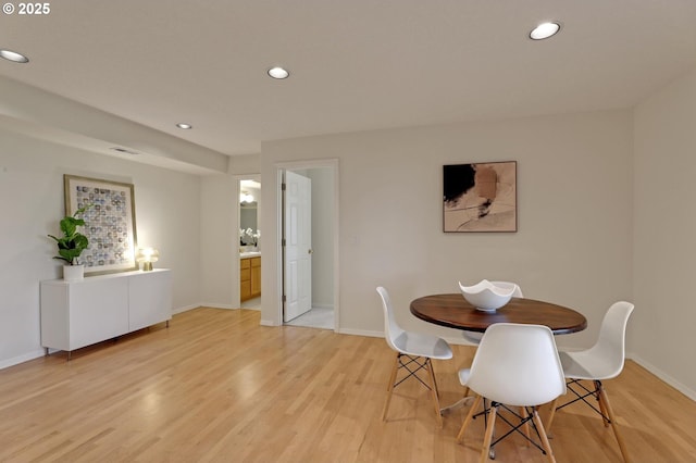 dining area with light wood-type flooring