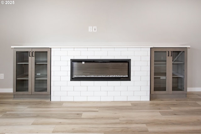 room details with baseboards and wood finished floors
