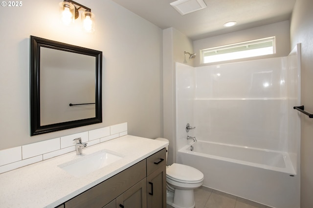 full bath featuring shower / bathing tub combination, tile patterned floors, vanity, and toilet