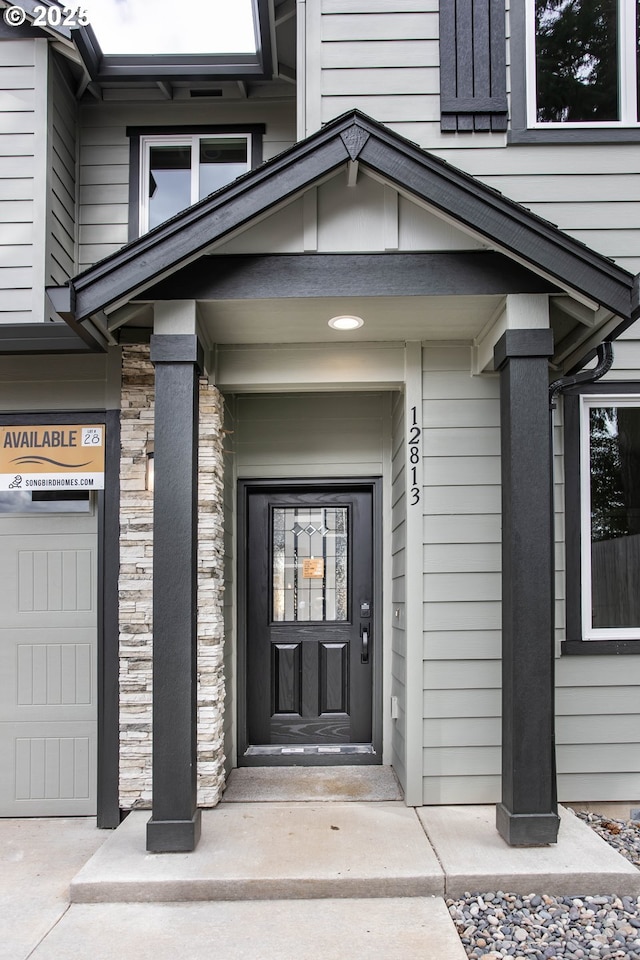 view of exterior entry featuring stone siding
