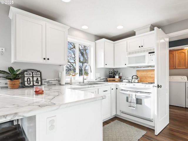 37388 SE Olson St, Sandy, OR 97055 - kitchen with white appliances, a sink, white cabinetry, recessed lighting, and washer and dryer