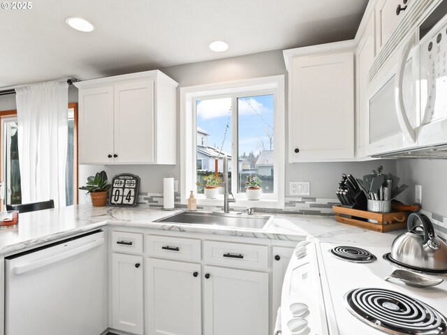 37388 SE Olson St, Sandy, OR 97055 - kitchen featuring white appliances, a sink, white cabinetry, recessed lighting, and light stone countertops
