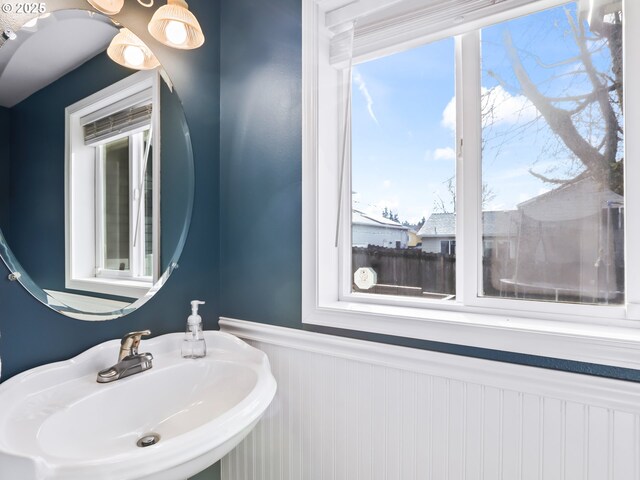 37388 SE Olson St, Sandy, OR 97055 - bathroom with a sink, a wainscoted wall, and healthy amount of natural light
