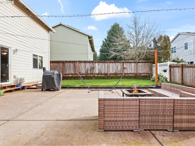 37388 SE Olson St, Sandy, OR 97055 - fenced backyard with a patio, grilling area, and an outdoor living space with a fire pit