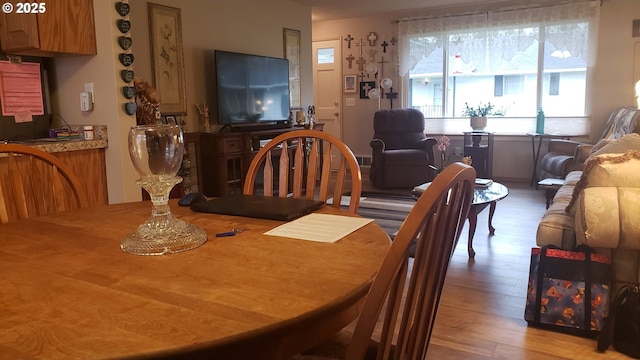 dining space with light wood-type flooring