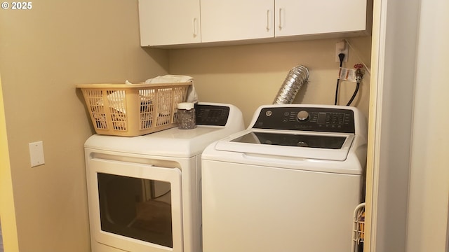 laundry area featuring cabinets and washer and dryer