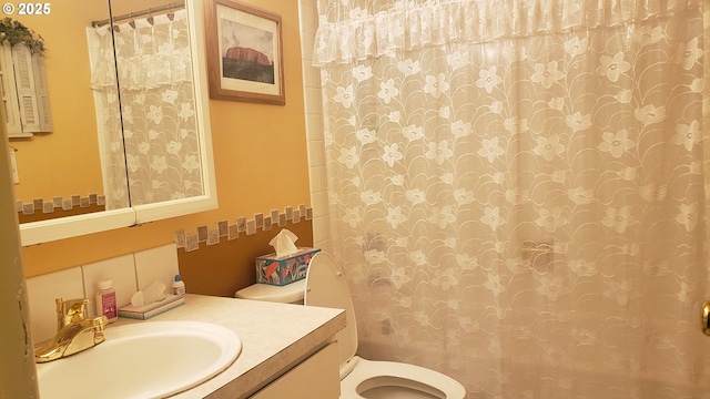 bathroom with backsplash, toilet, vanity, and a shower with curtain