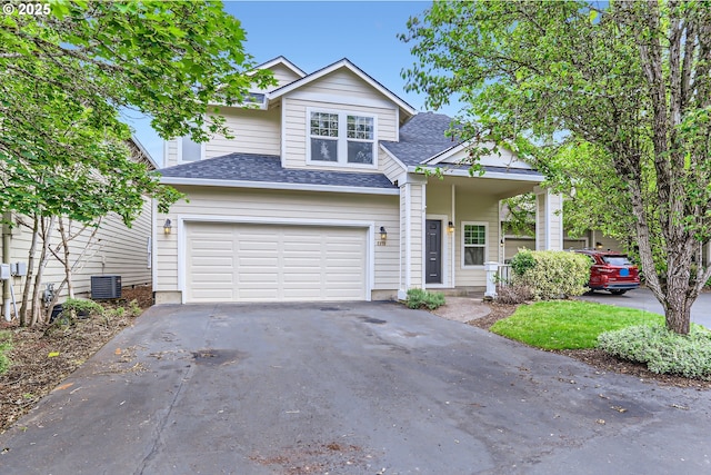 2370 NE 12th Way, Hillsboro, OR 97124 - view of front of property featuring asphalt driveway, a garage, roof with shingles, and central air condition unit