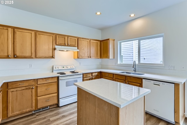 2370 NE 12th Way, Hillsboro, OR 97124 - kitchen featuring white appliances, a sink, under cabinet range hood, light countertops, and light wood-style floors