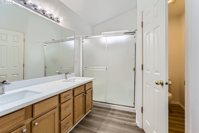 2370 NE 12th Way, Hillsboro, OR 97124 - bathroom featuring wood finished floors, a shower stall, toilet, and vaulted ceiling