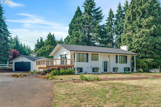 6195 Pear Tree Ln SE, Salem, OR 97317 - split foyer home with a deck, a chimney, an outdoor structure, a garage, and asphalt driveway