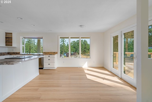 6195 Pear Tree Ln SE, Salem, OR 97317 - kitchen featuring stone counters, white cabinets, light wood-type flooring, open shelves, and stainless steel dishwasher