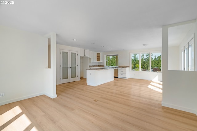 6195 Pear Tree Ln SE, Salem, OR 97317 - unfurnished living room featuring light wood-type flooring, recessed lighting, and french doors