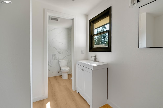 6195 Pear Tree Ln SE, Salem, OR 97317 - bathroom featuring vanity, wood finished floors, and a marble finish shower