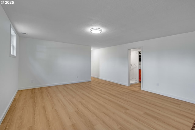 6195 Pear Tree Ln SE, Salem, OR 97317 - empty room featuring light wood-style floors and a textured ceiling