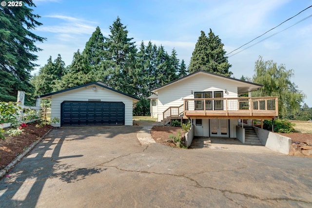 6195 Pear Tree Ln SE, Salem, OR 97317 - view of front of property with stairs, french doors, a deck, a garage, and an outdoor structure