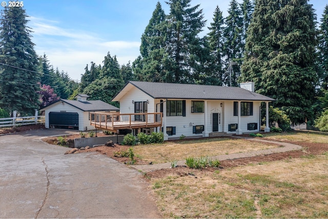 6195 Pear Tree Ln SE, Salem, OR 97317 - bi-level home featuring driveway, an outbuilding, a chimney, and a deck