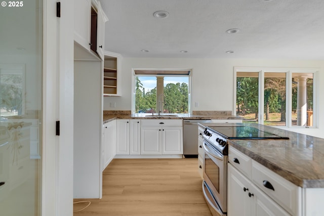 6195 Pear Tree Ln SE, Salem, OR 97317 - kitchen with stainless steel range with electric stovetop, dishwasher, light wood-style flooring, stone countertops, and plenty of natural light
