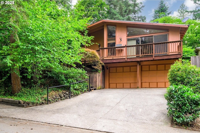 761 Foothill Dr, Eugene, OR 97405 - view of front of home featuring an attached garage, driveway, and a balcony