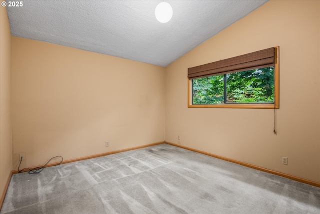 761 Foothill Dr, Eugene, OR 97405 - unfurnished room with lofted ceiling, carpet flooring, and a textured ceiling