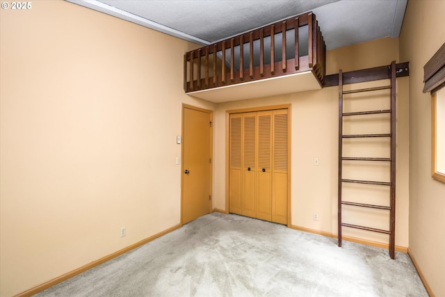761 Foothill Dr, Eugene, OR 97405 - unfurnished bedroom featuring carpet flooring, a closet, and a textured ceiling