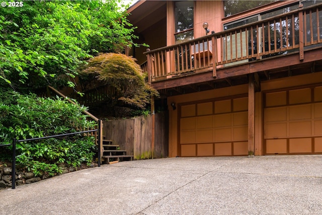 761 Foothill Dr, Eugene, OR 97405 - view of side of property featuring an attached garage, driveway, and a balcony