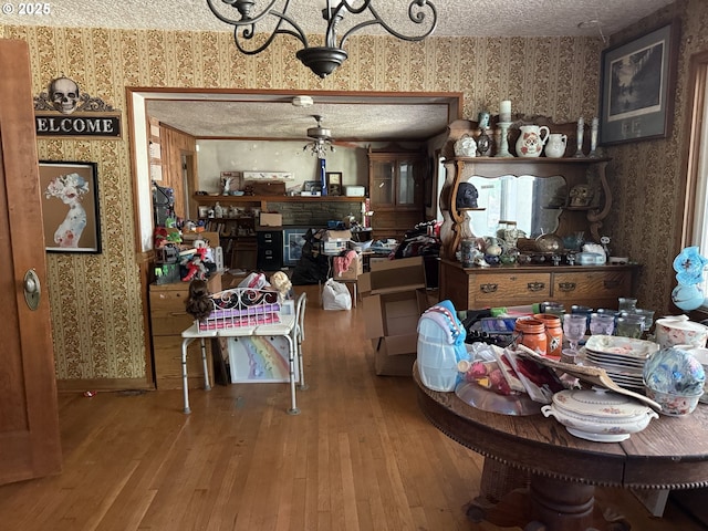 8270 SW Sorrento Rd, Beaverton, OR 97008 - dining room with wallpapered walls, hardwood / wood-style floors, and a chandelier