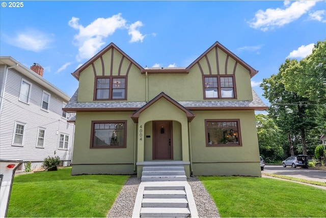 4004 N Montana Ave, Portland, OR 97227 - english style home featuring stucco siding, a front yard, and roof with shingles