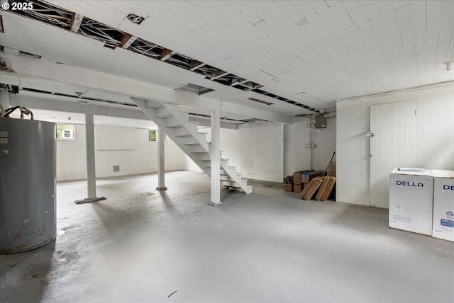4004 N Montana Ave, Portland, OR 97227 - basement featuring water heater, stairs, and fridge