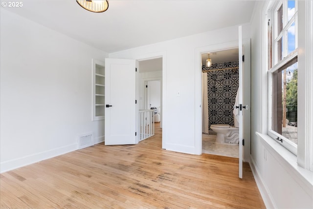 4004 N Montana Ave, Portland, OR 97227 - unfurnished bedroom with light wood-style flooring and ensuite bathroom