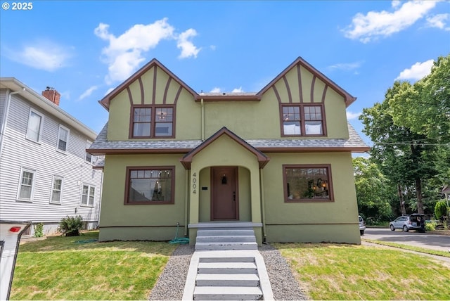 4004 N Montana Ave, Portland, OR 97227 - tudor home with stucco siding, a front yard, and roof with shingles
