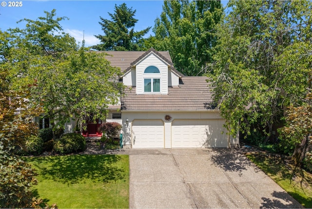 16165 NW Blueridge Dr, Beaverton, OR 97006 - view of front of home with driveway, a front yard, and a tile roof