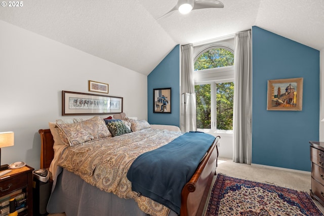 16165 NW Blueridge Dr, Beaverton, OR 97006 - bedroom with vaulted ceiling, light colored carpet, a textured ceiling, and ceiling fan