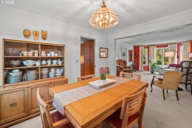 16165 NW Blueridge Dr, Beaverton, OR 97006 - dining area featuring light carpet, a chandelier, ornamental molding, and a textured ceiling